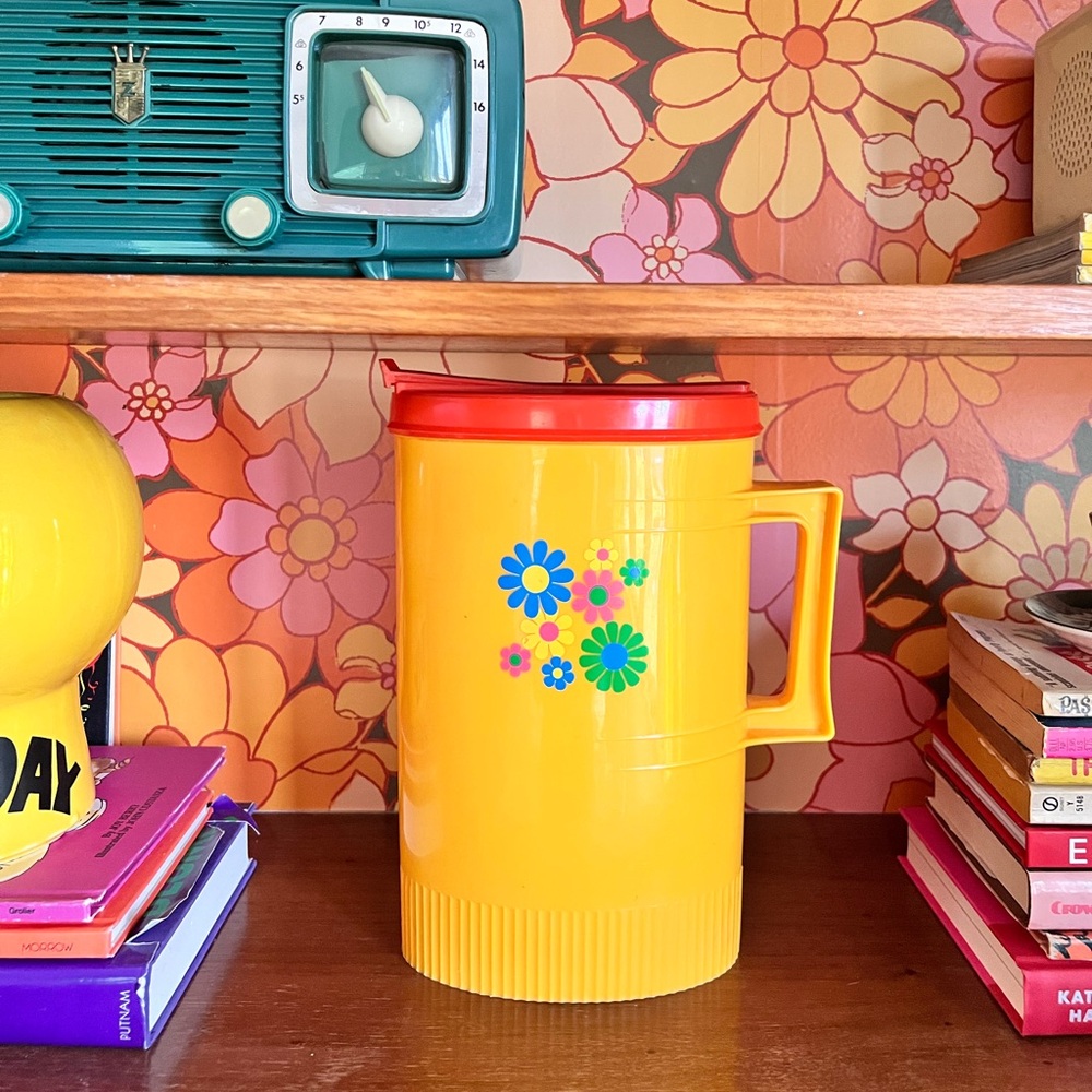 Vintage plastic flower power pitcher.